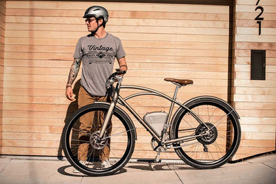 Man standing by VEB bike