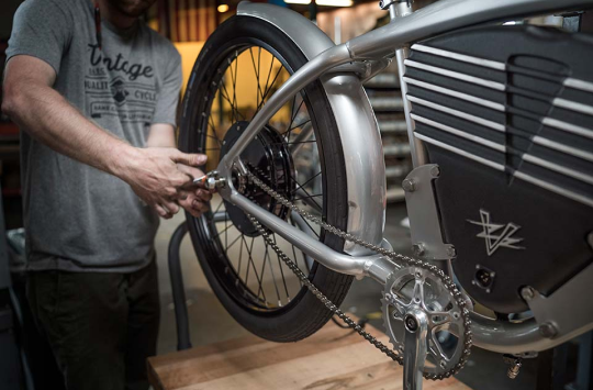 Vintage team member working on a bike in the workshop