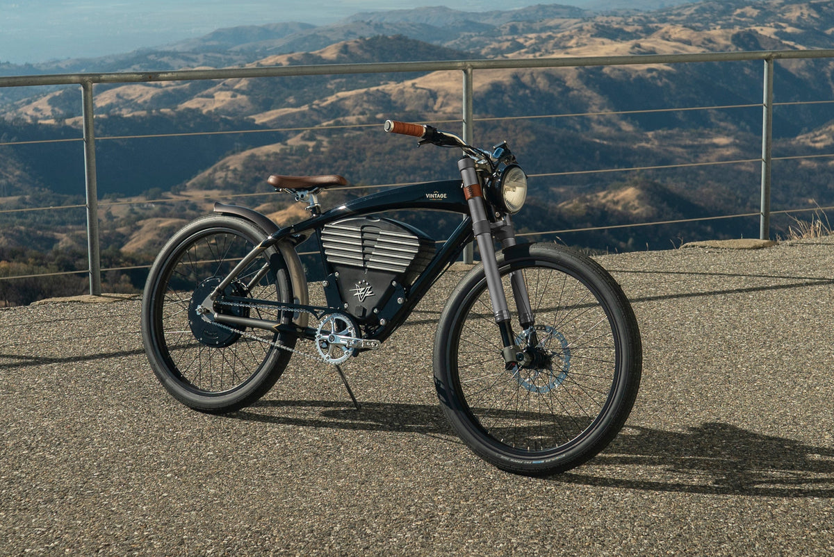 electric bike on a scenic road with mountains in the background