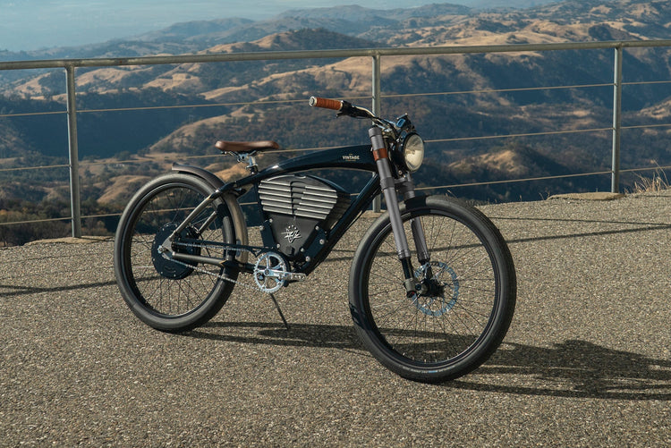 electric bike on a scenic road with mountains in the background